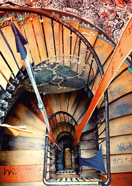 Graffiti-covered spiral staircase in Paris