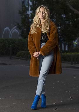 Woman in Faux Fur Coat and Blue Boots