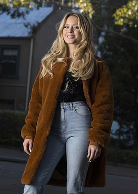 Woman in Fur Coat and Jeans