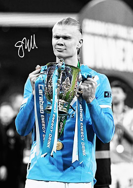 Erling Haaland holding trophy