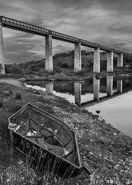 Old Boat Under a Railway Bridge