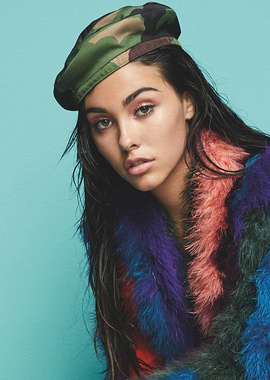 Fashionable Madison Beer in colorful coat and camouflage beret