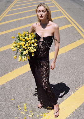 Gigi Hadid in a black lace dress with tulips