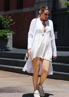 Woman in white dress walking outdoors