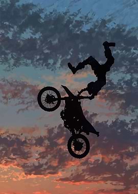 Motocross rider performing a stunt at sunset