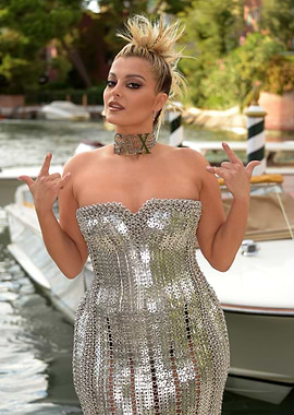 Bebe Rexha in a metallic dress