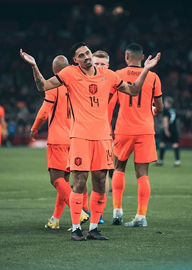 Soccer player with arms raised