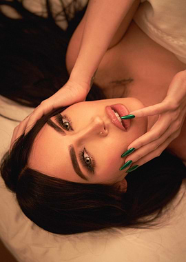 Woman with Green Nails Touching Lips