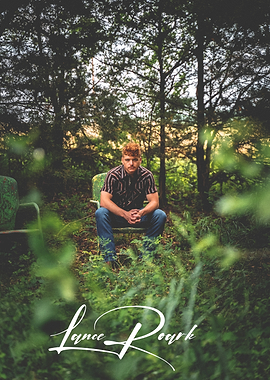 Lance Roark in vintage chairs outdoors