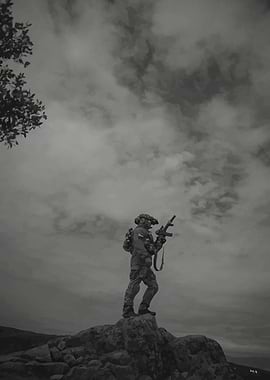 Soldier on a rocky outcrop