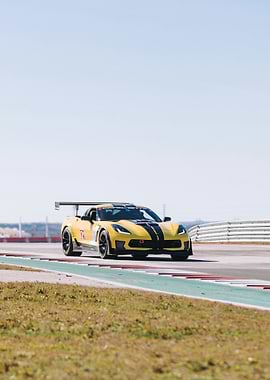 Yellow Corvette C7 on a Race Track