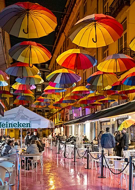 Colorful umbrellas over street cafe - Lisbon