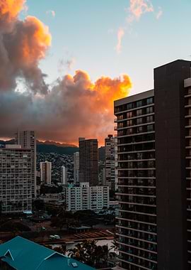 Cityscape at Sunset with Dramatic Clouds