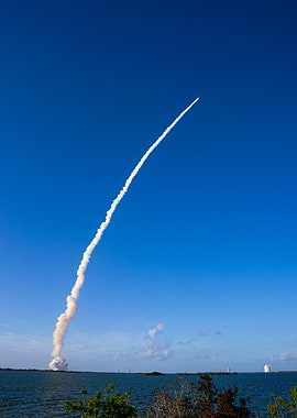 Rocket Launch Trail Against Blue Sky