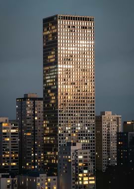 Cityscape at Dusk with Illuminated Skyscrapers