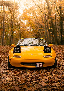 Yellow Mazda Miata in Autumn Forest