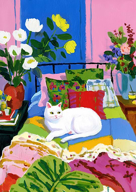 White Cat on a Colorful Quilt Bed