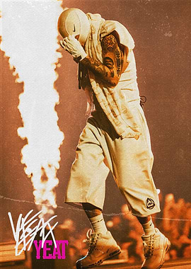 Yeat performing on stage with flames