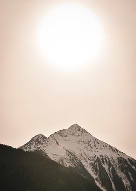 Snow-capped mountain peak at sunset