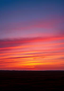 Vibrant Sunset Over a Field