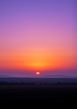 Vibrant Sunset Over Rolling Hills