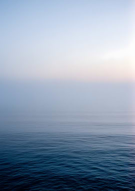 Misty Ocean Horizon at Sunrise