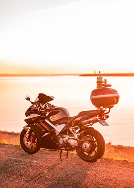 Honda VFR800 by the Water at Sunset