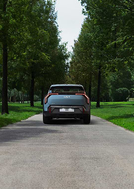 Kia EV9 Rear View on Tree Lined Road