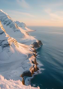 Snowy Mountains Meet the Ocean at Sunrise