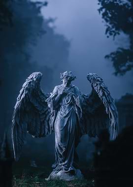 Angel Statue in Foggy Cemetery