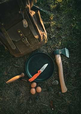 Camping cooking setup with backpack and axe