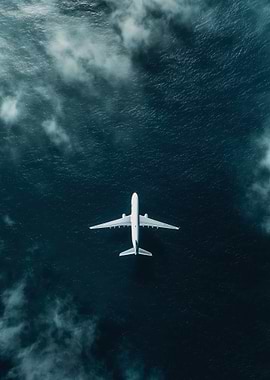 Airplane flying over the ocean