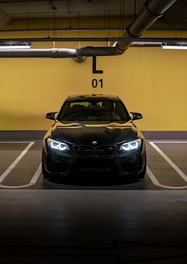 Black BMW M2 in Parking Spot