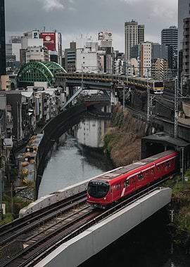 Red Train Crossing a Bridge in Tokyo