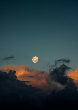 Full Moon Over Dramatic Clouds