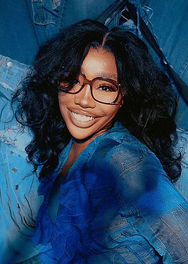 SZA in denim and blue ruffles