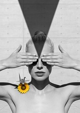 Woman with hands over eyes and sunflower