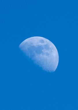 Half Moon in Blue Sky