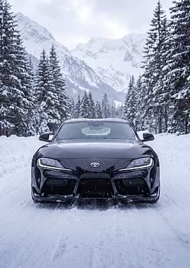 Black Toyota Supra in Snowy Mountains