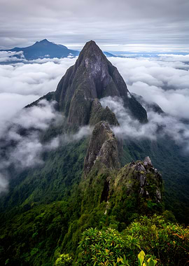 Jagged Mountain Peaks Above Clouds