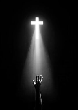 Hand Reaching for Lighted Cross