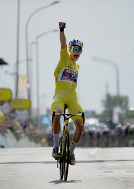 Cyclist in Yellow Jersey Celebrates Victory