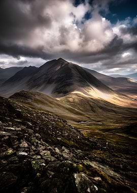 Dramatic Mountain Landscape with Sunlit Peaks