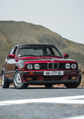 Red BMW E30 on a Mountain Road
