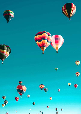 Hot Air Balloons Ascending in Blue Sky