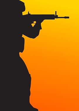 Soldier aiming rifle at sunset