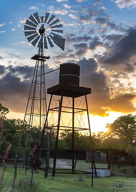 Windmill and Water Tower at Sunset