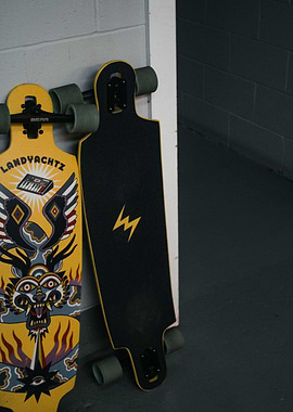 Two Longboards Leaning Against a Wall