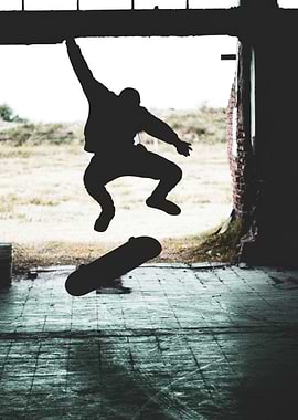 Skateboarder mid-air jump silhouette