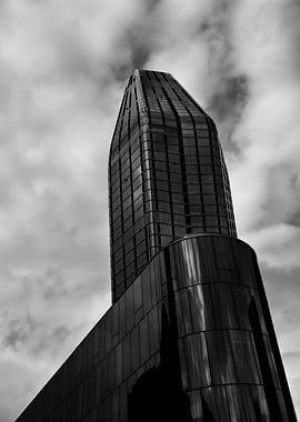 Modern Skyscraper Against Cloudy Sky